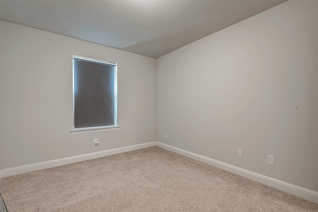 empty room with carpet flooring