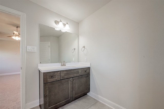 bathroom with ceiling fan, tile patterned flooring, and vanity