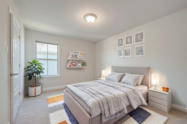 bedroom featuring light colored carpet