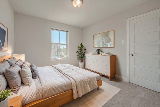 bedroom with light colored carpet