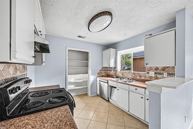 kitchen with stainless steel dishwasher, range with electric stovetop, and white cabinetry