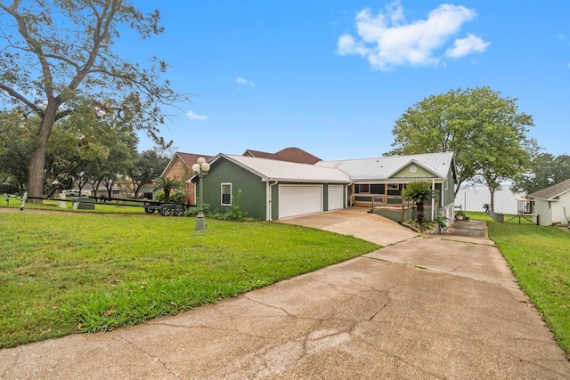 view of front of house with a porch, a front yard, concrete driveway, and a garage