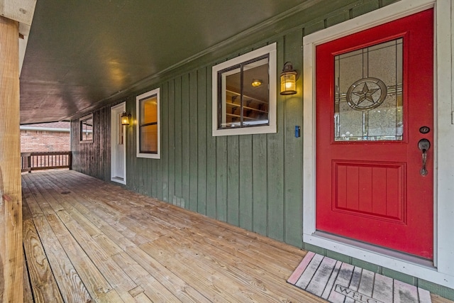 view of exterior entry with covered porch