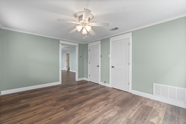 unfurnished bedroom featuring ornamental molding, dark wood-type flooring, and ceiling fan