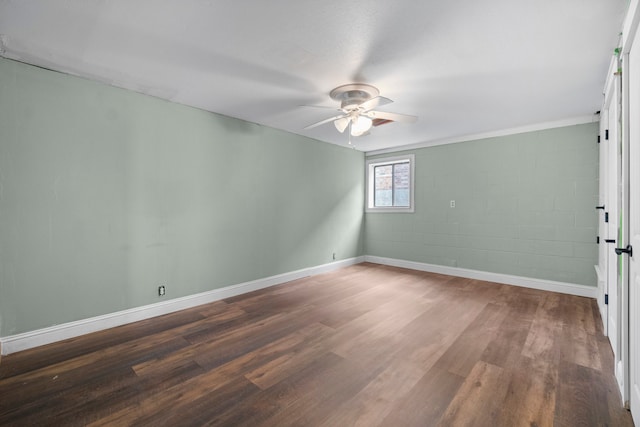 unfurnished room featuring ceiling fan and dark hardwood / wood-style floors