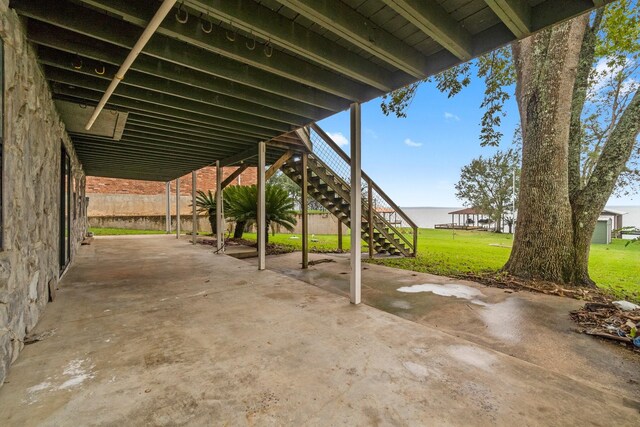 view of patio featuring a water view