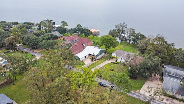 drone / aerial view featuring a water view and a residential view