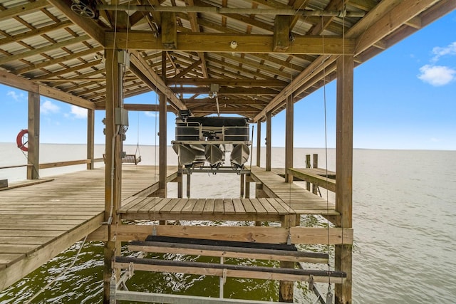 view of dock featuring a water view and boat lift