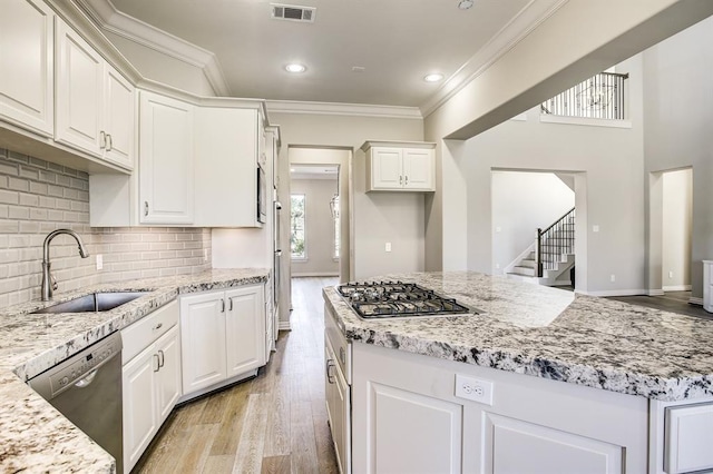 kitchen featuring sink, stainless steel appliances, and white cabinets