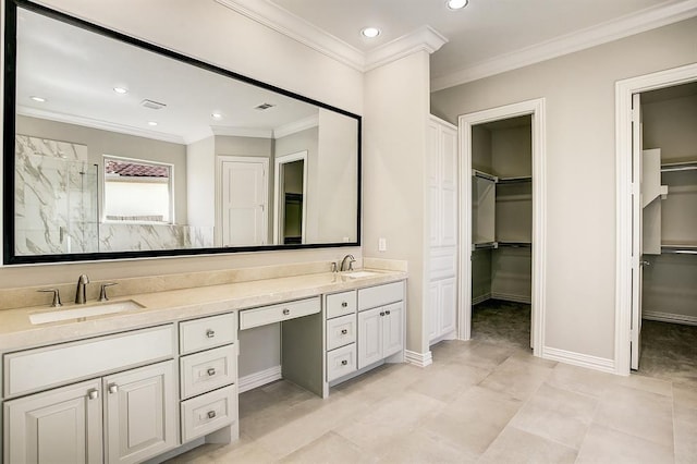 bathroom with vanity, crown molding, and walk in shower