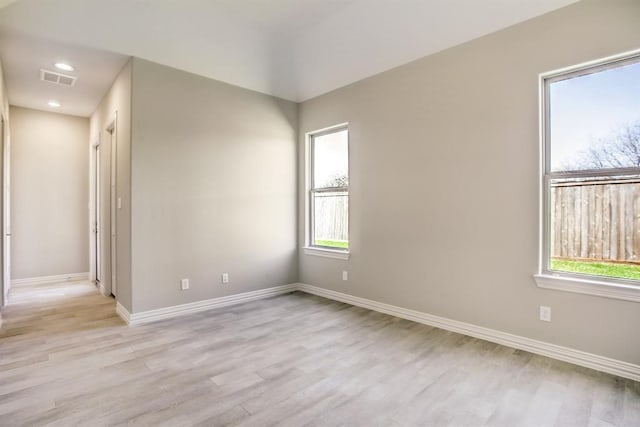 unfurnished room featuring light hardwood / wood-style flooring