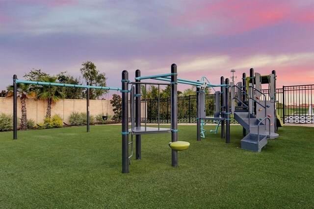 playground at dusk with a lawn