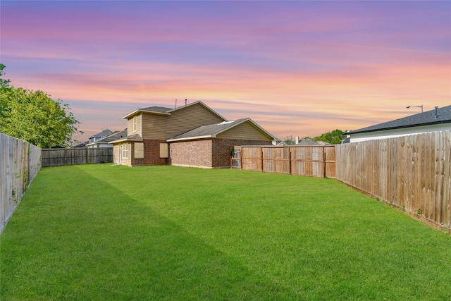 view of yard at dusk