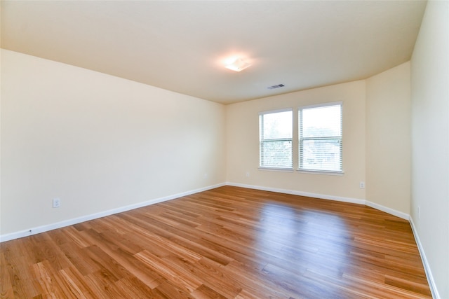 unfurnished room featuring light hardwood / wood-style flooring