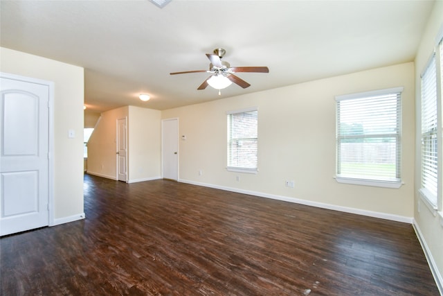 unfurnished room with dark hardwood / wood-style floors and ceiling fan