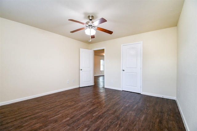 unfurnished room featuring ceiling fan and dark hardwood / wood-style flooring