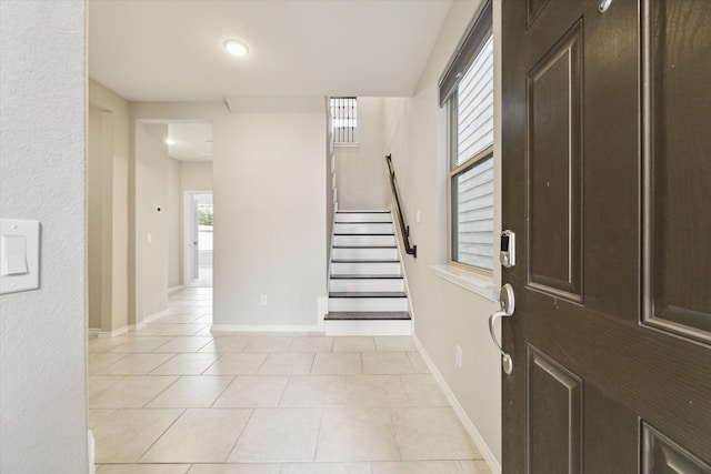 entrance foyer featuring light tile patterned floors