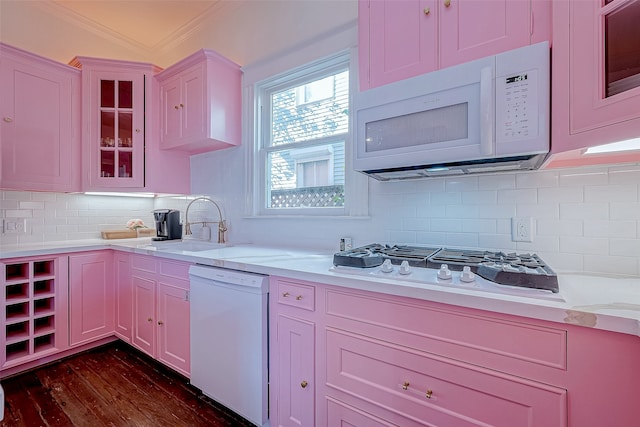 kitchen with ornamental molding, dark hardwood / wood-style floors, sink, decorative backsplash, and white appliances