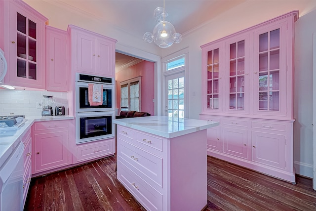 kitchen with tasteful backsplash, a kitchen island, appliances with stainless steel finishes, decorative light fixtures, and dark hardwood / wood-style flooring