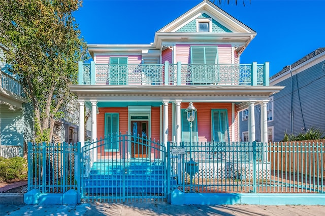 view of front of home with covered porch and a balcony