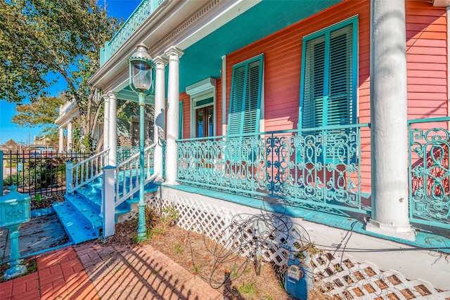 view of property exterior with covered porch