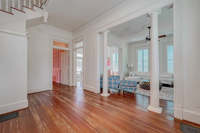 entrance foyer featuring ornamental molding, hardwood / wood-style flooring, and ceiling fan