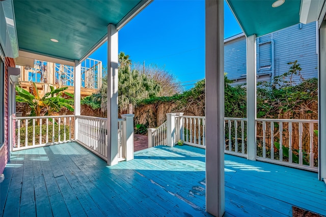 wooden terrace with a porch