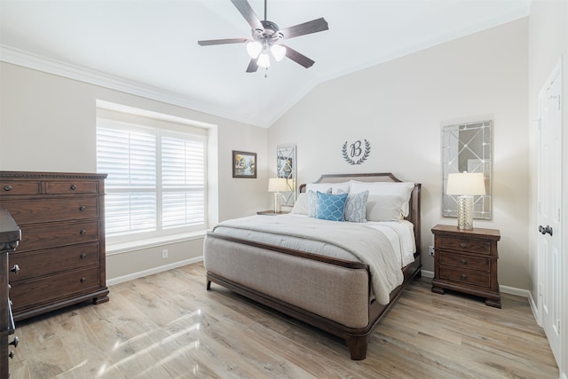 bedroom with vaulted ceiling, light hardwood / wood-style flooring, ceiling fan, and crown molding