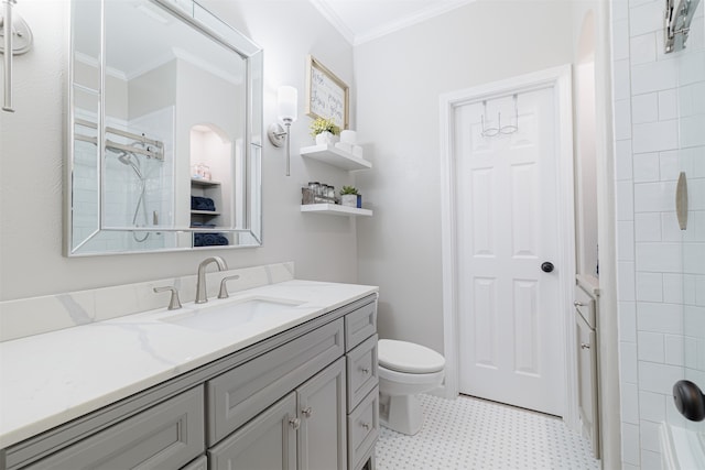 bathroom featuring a shower, vanity, toilet, and ornamental molding