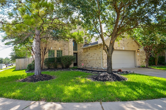 view of front of property with a garage and a front lawn