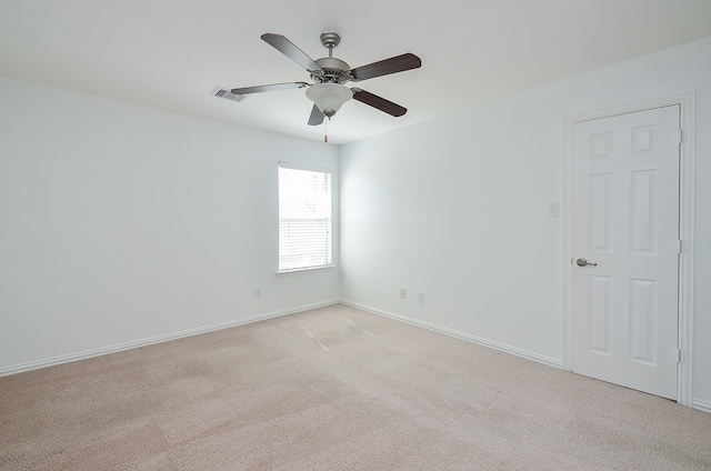 empty room featuring light carpet and ceiling fan