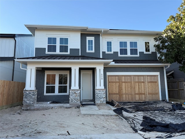 view of front of property featuring a porch, metal roof, a standing seam roof, and fence