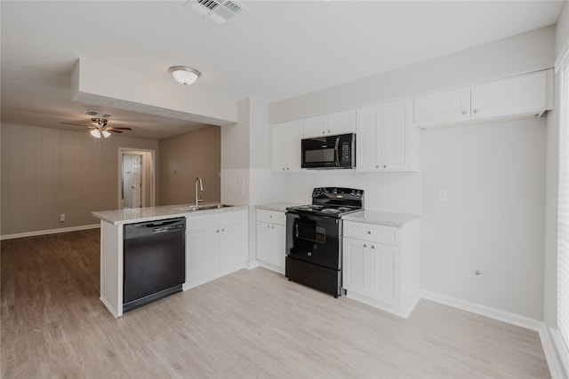 kitchen featuring white cabinetry, sink, black appliances, kitchen peninsula, and light wood-type flooring