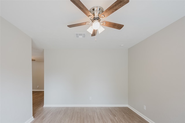 empty room with light wood-type flooring and ceiling fan