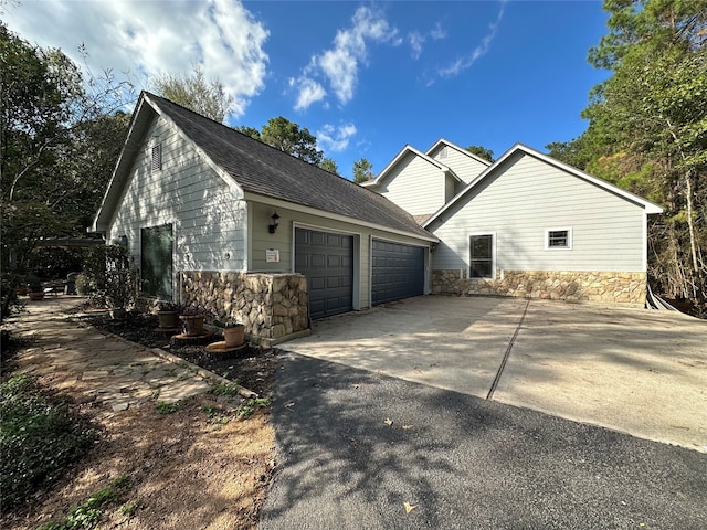 view of side of property with a garage