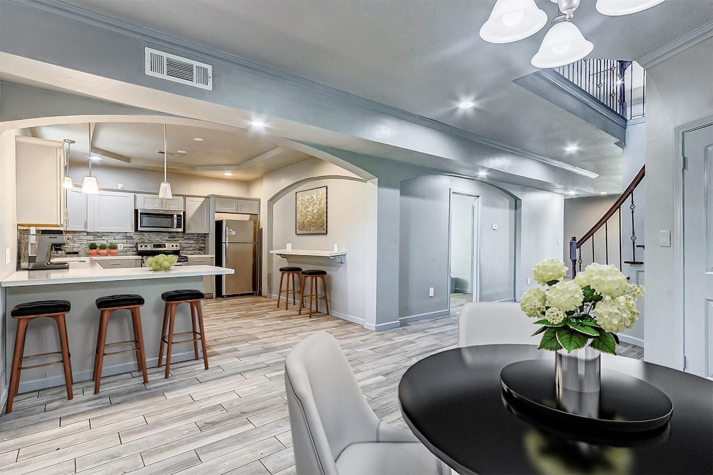 dining area featuring ornamental molding