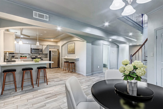 dining area featuring ornamental molding