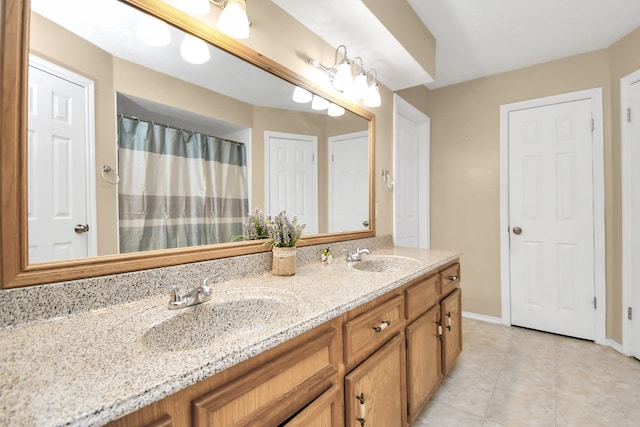 bathroom featuring tile patterned floors and vanity