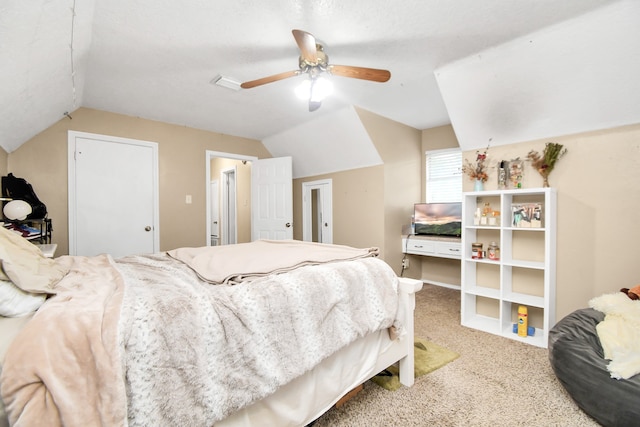 carpeted bedroom featuring ceiling fan and lofted ceiling