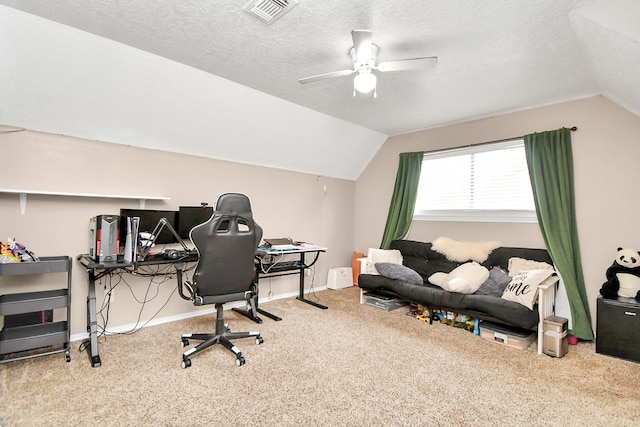 office featuring a textured ceiling, carpet floors, vaulted ceiling, and ceiling fan