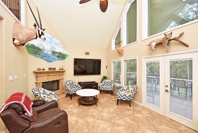 interior space featuring lofted ceiling, ceiling fan, and french doors