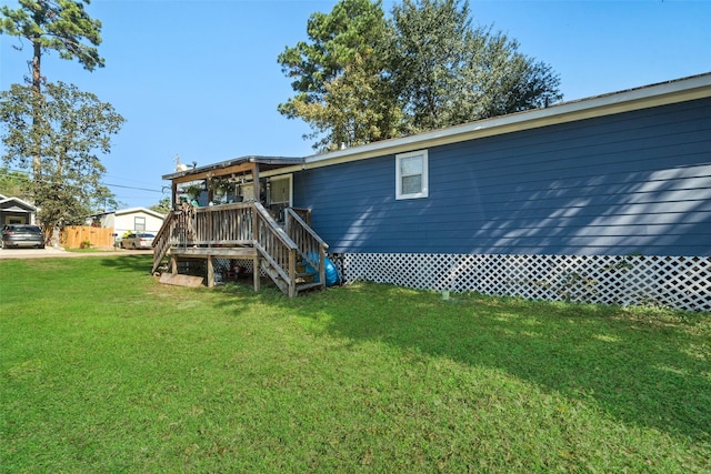 back of house with a lawn