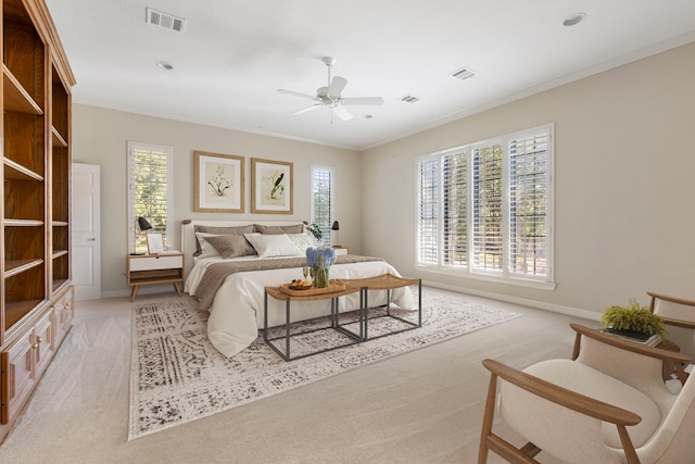 carpeted bedroom with multiple windows, ornamental molding, and ceiling fan