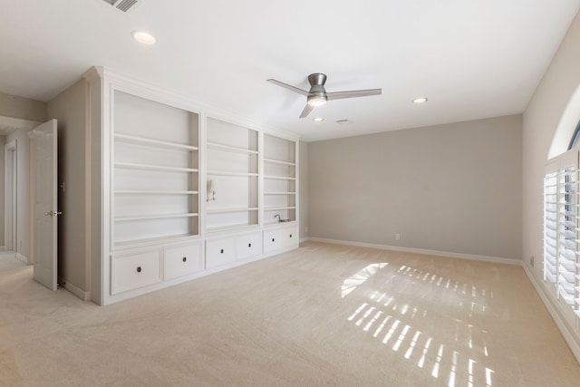 unfurnished bedroom with light carpet and ceiling fan