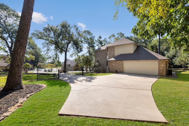 view of front of property featuring a front yard and a garage