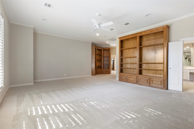 unfurnished living room with crown molding, ceiling fan, and light carpet