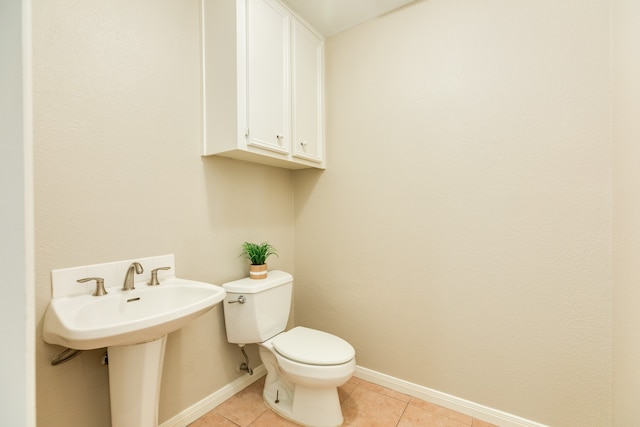 bathroom with tile patterned floors and toilet