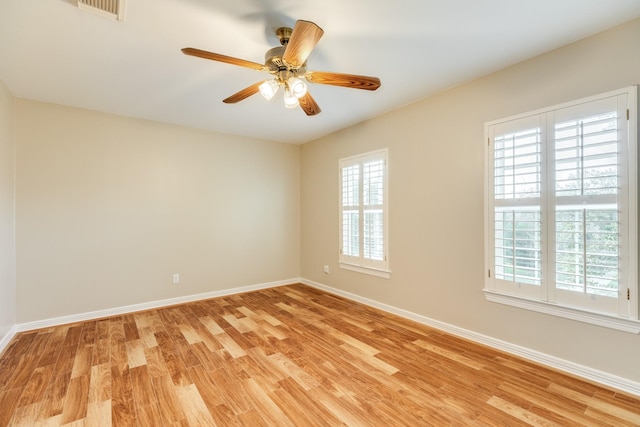 unfurnished room with light hardwood / wood-style flooring and ceiling fan