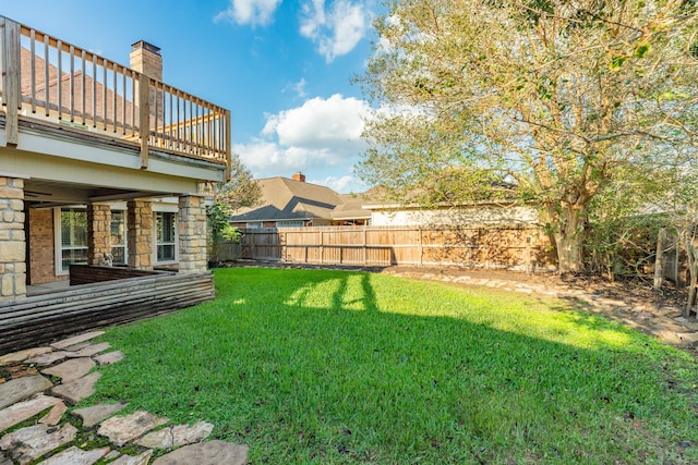 view of yard with a balcony