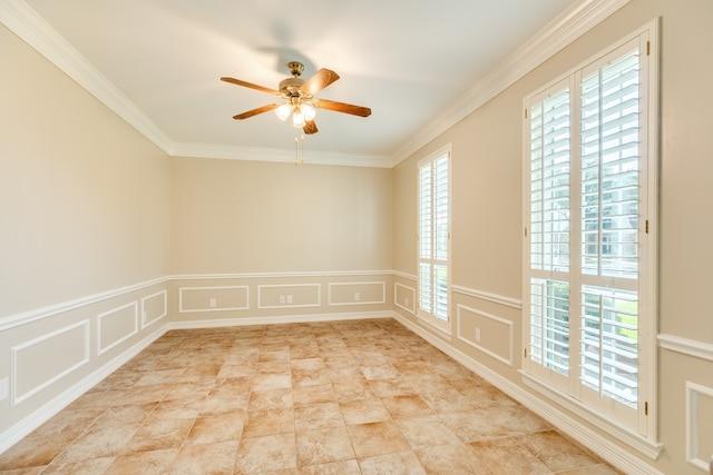 spare room featuring ceiling fan and ornamental molding